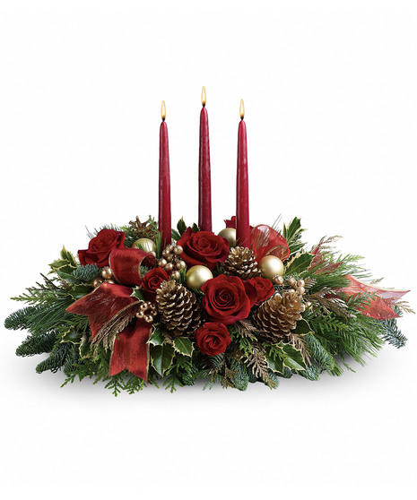 3 red taper candle centerpiece with red roses, spray roses, carnaitons, mini carnations, red ribbon, gold mm balls, pine cones in a design tray 