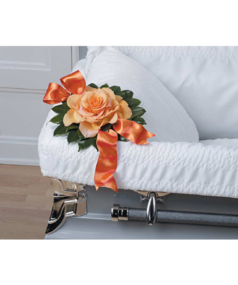 A composite peach rose to set inside the casket