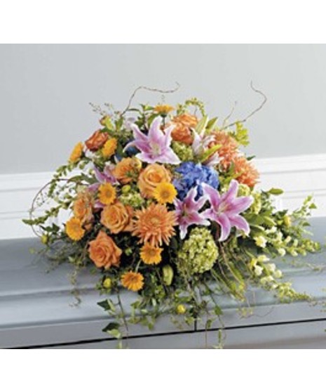 This magnificent arrangement includes hydrangeas, snapdragons, gerbera, roses, and lilies.