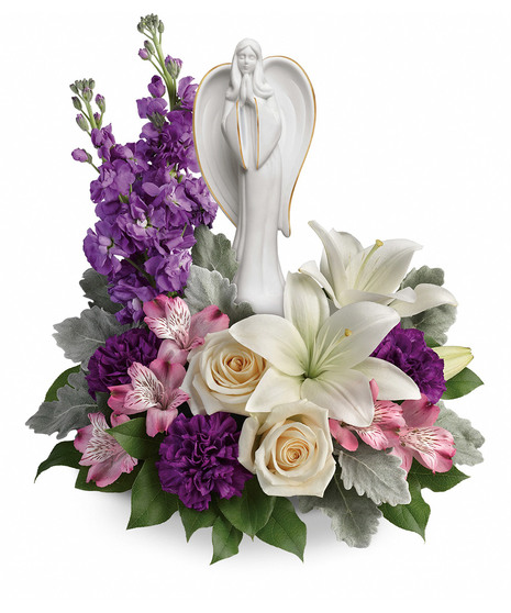  creme, white and lavender blooms includes fragrant roses and lilies to refresh and rejuvenate their spirits. Nestled among the blooms is a graceful angel sculpture -