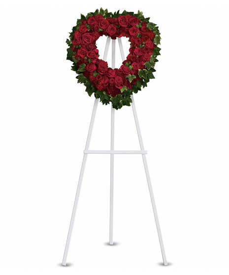 open heart on easel with red roses spray roses and pittosporum