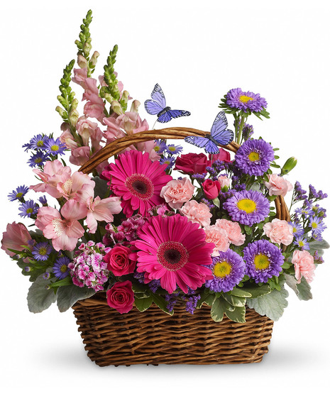 pink spray roses, alstroemeria, snapdragons, mini carnations, dark pink Sweet William, purple matsumoto asters, large monte cassino asters, statice and pittosporum in basket.