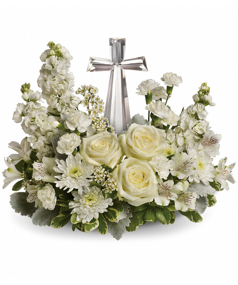 crystal keepsake cross with whtie and off white roses, mini carnations, alstroemeria, stock , eucalyputs, wax flowers and salal