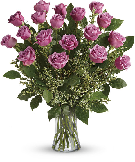 lavender roses come arranged with salal and seeded eualyptus in clea glass vase