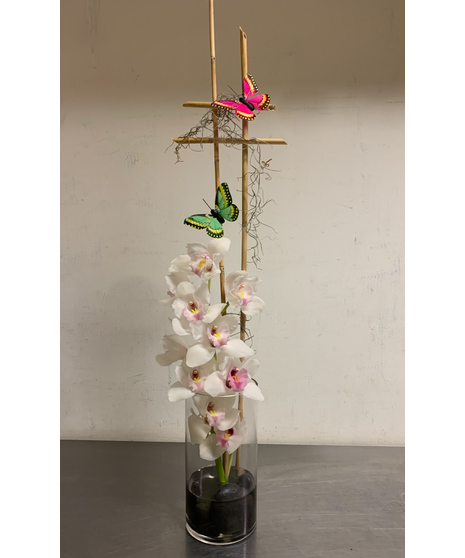 cymbidium in cylinder with bamboo trellis and butterflies on trellis