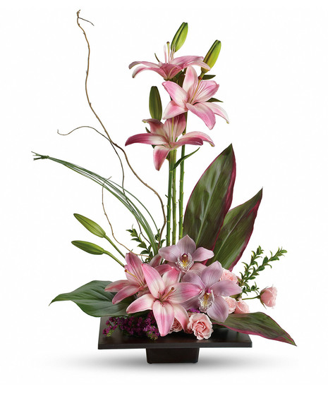 hi style arrangement with pink lilies on top and pink cymbidium flowers , lilies and spray roses at the bottom topiary look 