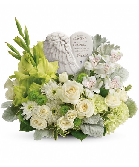 angel wing keepsake surrounded by green gladiola, green buttons, dusty miller, variegated pittosporum, white roses, spray roses, alstroemeria and mums  