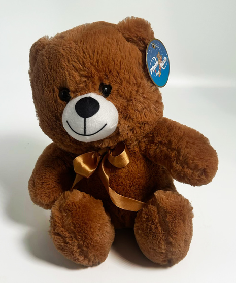 a sitting bear in your choice of white brown or tan with a red ribbon on the neck