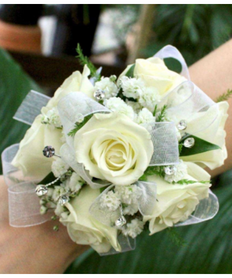 prom corsage with white ribbon and white spray roses with baby's breath