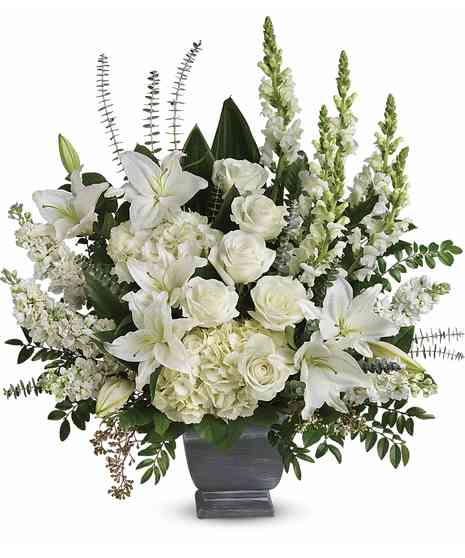 white hydrangeas, liies, roses, snapdragons in slate fiberglass rectangle shape container with spiral eucalyptus, emerald, jade and salal 