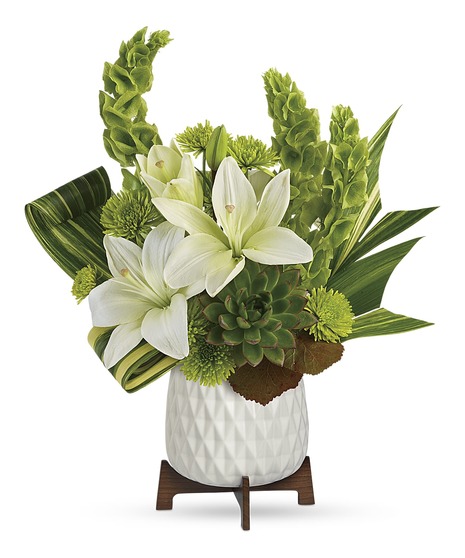 stunning gift from any angle! Add style to their celebration with this artistic lily arrangement, presented in a chic mid-century ceramic planter with sleek wood base.